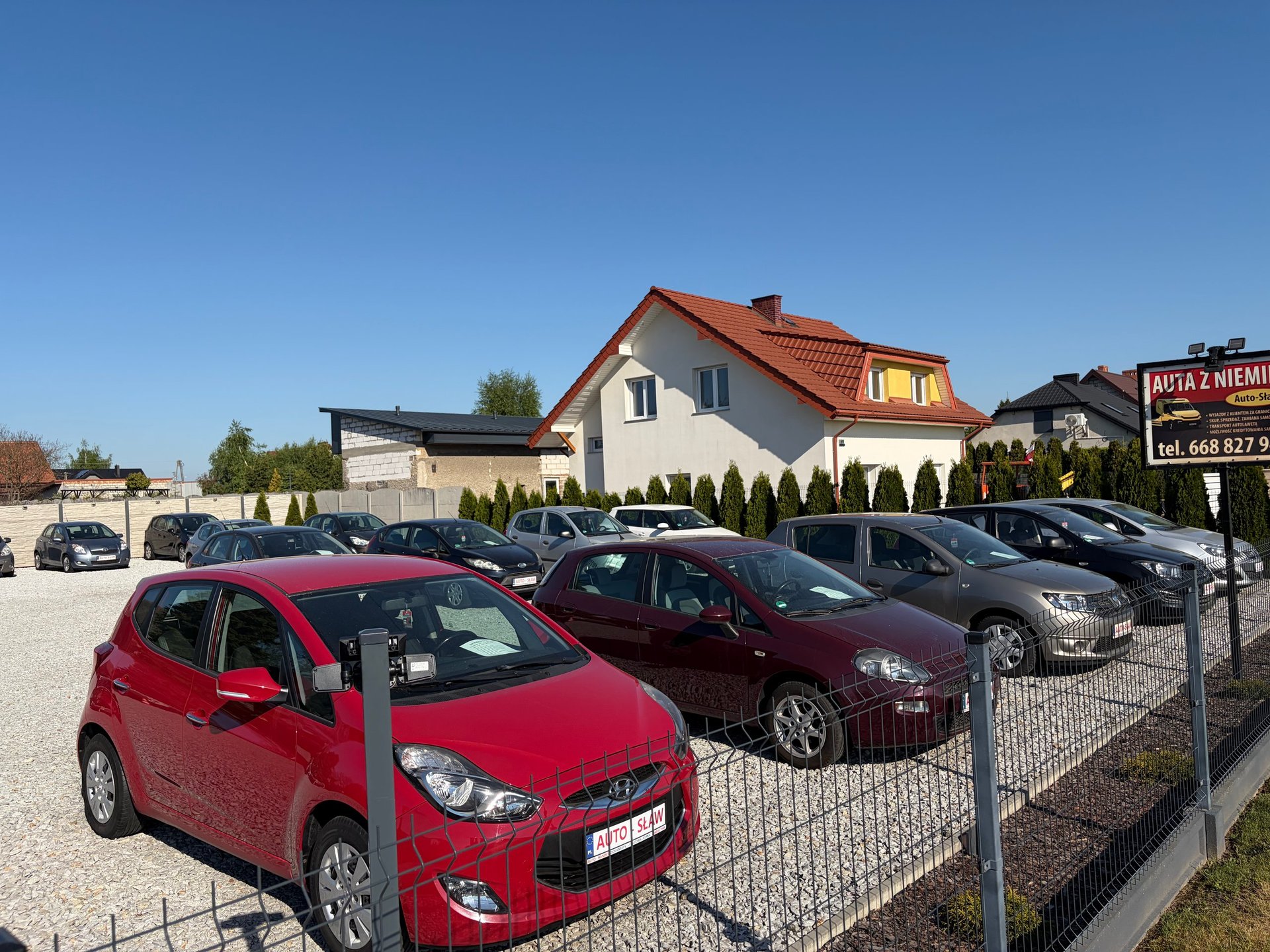 Car dealership lot with multiple used vehicles for sale
