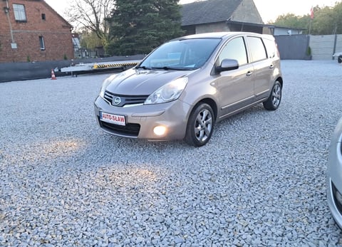 Silver Nissan Note compact car